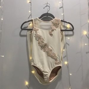 Elegant custom creme lyrical costume.